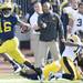 Michigan senior quarterback Denard Robinson carries the ball for yards   during the first quarter at Michigan Stadium. Melanie Maxwell I AnnArbor.com